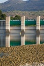 Floodgates at the Beniarres Dam in September 2025, with reflection in the water Royalty Free Stock Photo