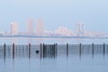Flooding on the Amur river on a foggy morning. Boardwalk fencing. In the haze, the neighboring city of Heihe, China. View from the