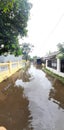 Flooding that inundated the road village Royalty Free Stock Photo