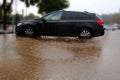 Flooding in Israel. It is raining, a huge puddle has spread to the entire car parking