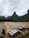 Flooding river and lots docked boats green trees