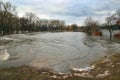 Flooding of river in spring in town during melting of snow. Natural disaster Royalty Free Stock Photo
