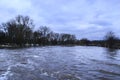 Flooding of river in spring in town during melting of snow. Natural disaster Royalty Free Stock Photo