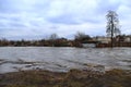 Flooding of river in spring in town during melting of snow. Natural disaster Royalty Free Stock Photo