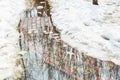 Flooding of tile walkpath due to snow melting and rising of water level. Blue sky in puddle reflection.Spring emergency incident.