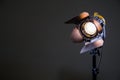 Floodlight with halogen lamp and Fresnel lens on a gray background. Lighting equipment for shooting Royalty Free Stock Photo