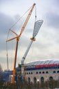 Floodlight tower installation in the stadium. Construction Scene
