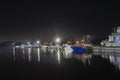 Floodlights illuminate the boat station.