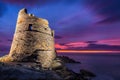 Floodlit Genoese tower at Erbalunga in Corsica at sunrise