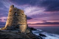 Floodlit Genoese tower at Erbalunga in Corsica at sunrise Royalty Free Stock Photo