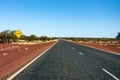 The floodway warning sign in Western Australia on a straight outback road