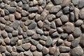 The floor background is made of rounded stones. Cobblestone pebble Royalty Free Stock Photo