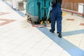 Floor care and cleaning services with washing machine in supermarket. disinfection and sanitization.
