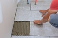 Floor ceramic tile installation with home construction working Royalty Free Stock Photo