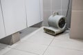 Floor dryer blower fan machine in bathroom drying wet floor