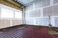 Floor heating in a new building. Interior design and finishing industry