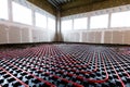 Floor heating in a new building. Interior design and finishing industry