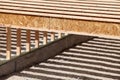 Silent style floor joists, made from engineered wood, in the floor of an office building being constructed.