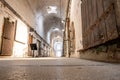 Floor level point of view of a lit cellblock of Eastern State Penitentiary historic site. Royalty Free Stock Photo