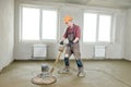 Floor machine grinding by power trowel Royalty Free Stock Photo