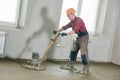 Floor machine grinding by power trowel Royalty Free Stock Photo