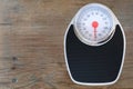 floor mechanical scales in vintage style, scale with red arrow in circle in circle, top view, the concept of weight control, human