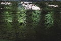 Floor of an old abandoned swimming pool. construction waste. reflection of light on the wet surface of the ceramic tiles Royalty Free Stock Photo