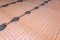 Floor repair, installation of concrete screed guides. Setting the level for pouring concrete. Repair and rough finishing Royalty Free Stock Photo