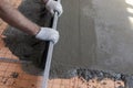 Floor repair, installation of concrete screed guides. Setting the level for pouring concrete. Repair and rough finishing Royalty Free Stock Photo