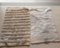 Floor rugs in beige colour. Just washed and looking old and worn Royalty Free Stock Photo