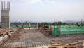 Floor slab and beam reinforcement bar under fabrication at the construction site by workers.