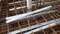 Floor slab and beam reinforcement bar under fabrication at the construction site by workers.