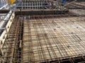 Floor slab and beam reinforcement bar under fabrication at the construction site by workers.