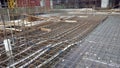 Floor slab and beam reinforcement bar under fabrication at the construction site by workers.