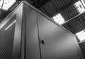 Close-up of a tall Computer and Networking Server cabinet seen within a factory. Royalty Free Stock Photo