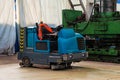 Floor sweeper and washer scrubber drier car in an industrial building