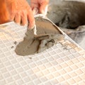 Floor tile installation for house building Royalty Free Stock Photo