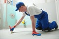 Floor waterproofing in bathroom. Worker adding Ãâ ater resistant, protective coating