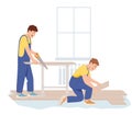 Floor worker man laying wooden panel of laminate Professional contractors installing a floor, they are cutting and