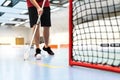 Floorball Player Training On Court. Floor Hockey Concept. Man Running With Stick And Ball In Arena.