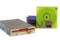 Floppy disk drive and diskettes on white background Royalty Free Stock Photo