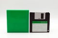 Floppy disk of 1.4 megabytes isolated on white background and plastic protective box Royalty Free Stock Photo