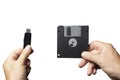 A floppy disk and a USB key