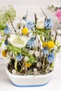 Floral arrangement with anemones and grape hyacinths