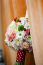 Floral arrangement on a baptismal candle Royalty Free Stock Photo