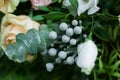 Floral arrangement consists of silver brunia, eucalyptus, orange and white roses Royalty Free Stock Photo