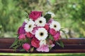 Gerbera, peonies and pink roses in a large wedding bridal arrangement, with blurred background