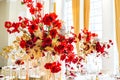 Floral arrangement, festive bouquet, table decoration for Chinese New Year party celebration in restaurant. Traditional Royalty Free Stock Photo