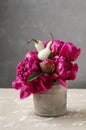 Floral arrangement with orchid and craspedia flowers Royalty Free Stock Photo