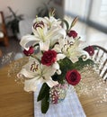 Floral arrangement with red roses and white lilies Royalty Free Stock Photo